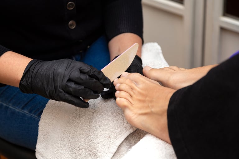 Pedicure session at beauty salon, professional nail polishing